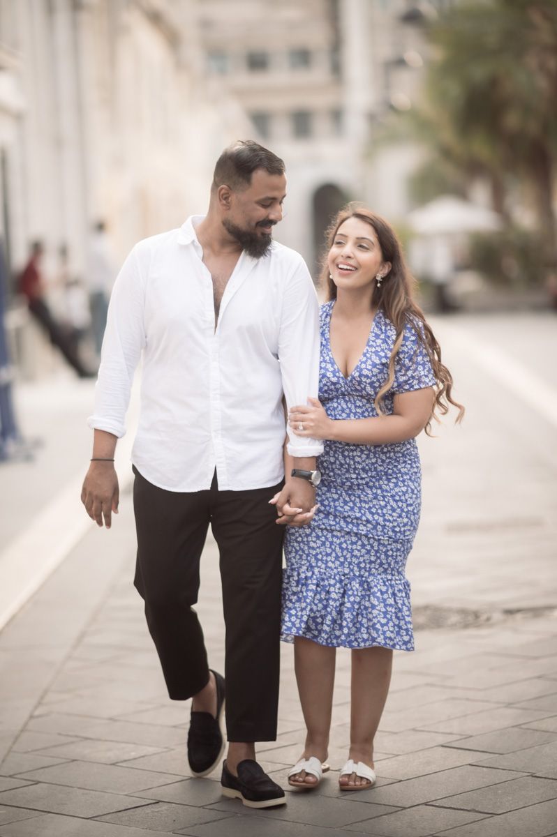 A couple walk through Nice's old town during a romantic photoshoot