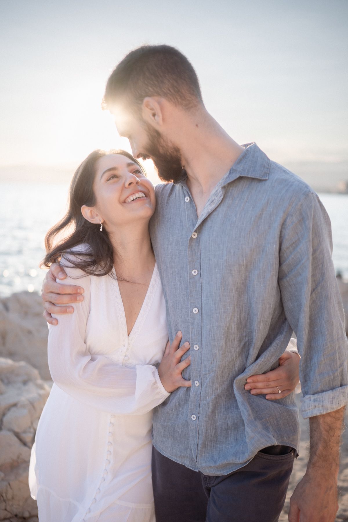 A backlit professional couple portrait taken during golden hour on the French Riviera.