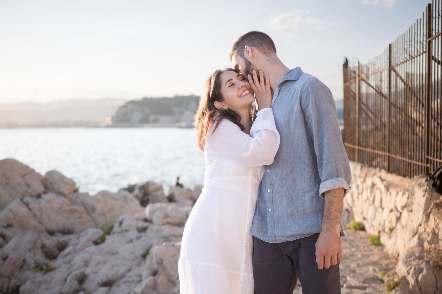 A couple pose naturally during a romantic golden hour couple shoot on Coco Beach.