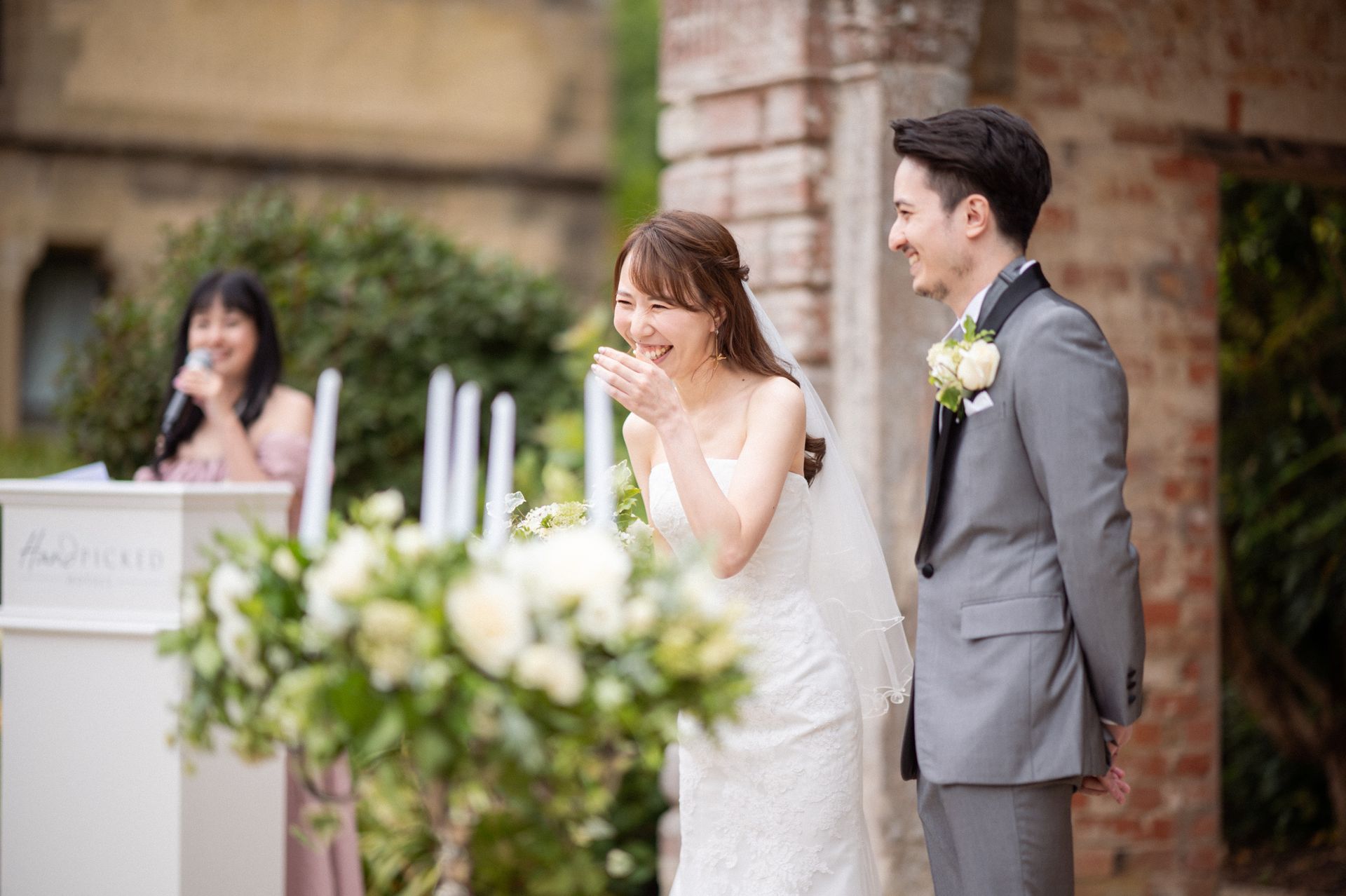 Wedding guests watch their loved ones get married.