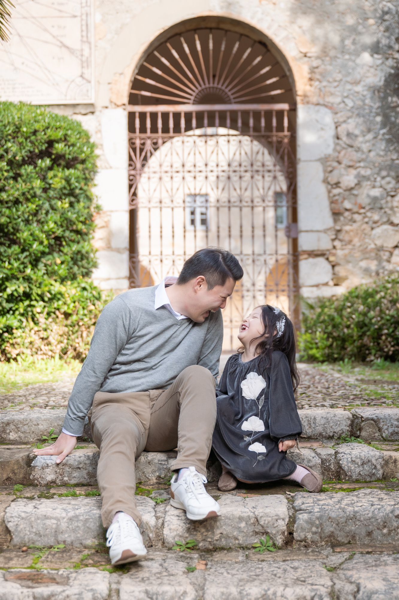 father and daughter playing unposed during a family photoshoot in Nice, France