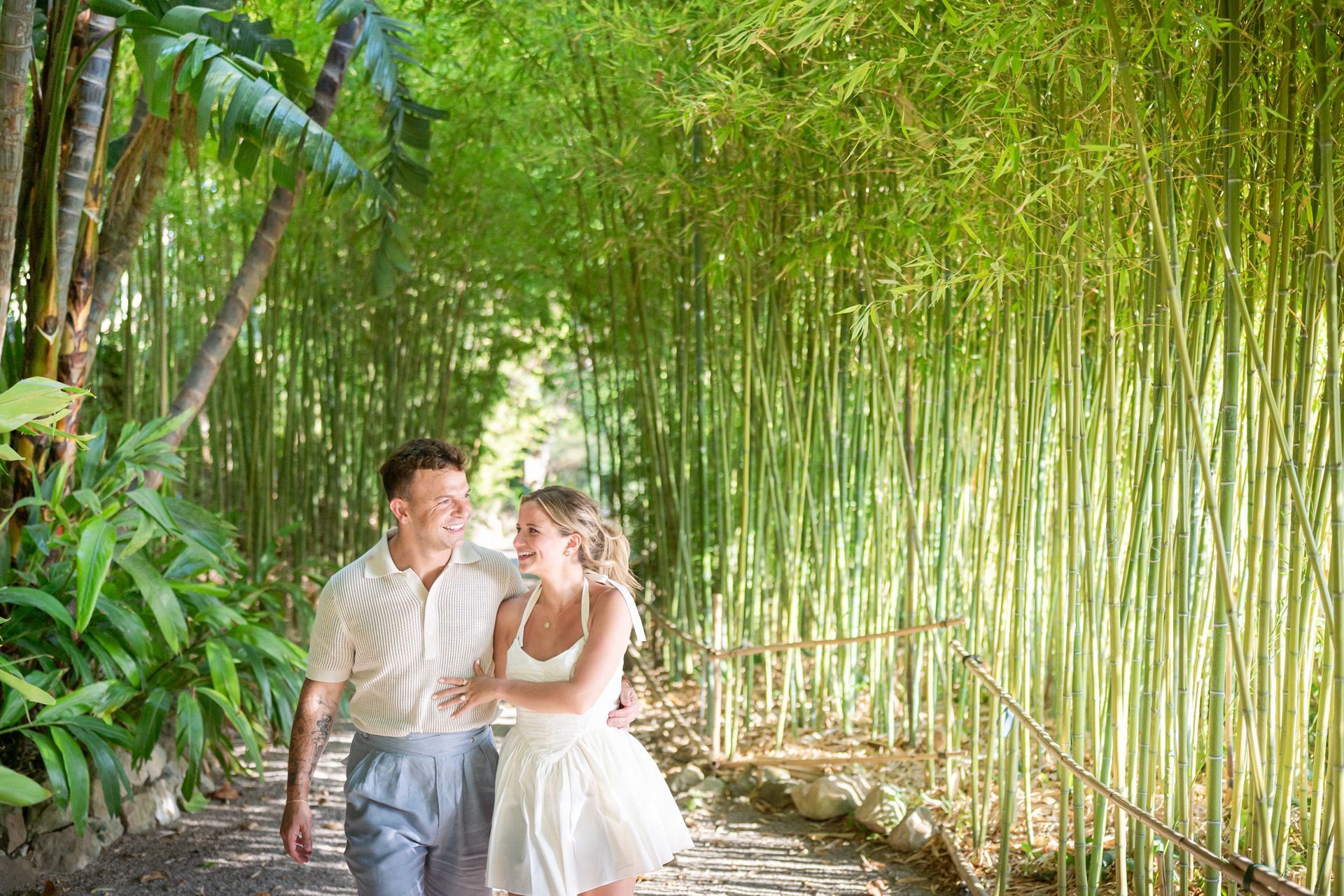 A couple walking through the gardens at villa ephrussi.