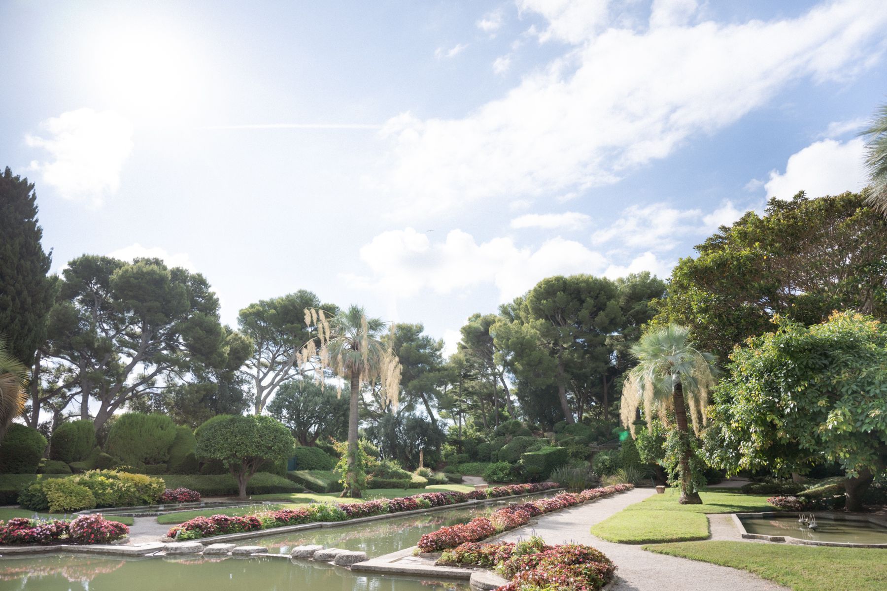 A professional wide angle photograph of the gardens at Villa Ephrussi.