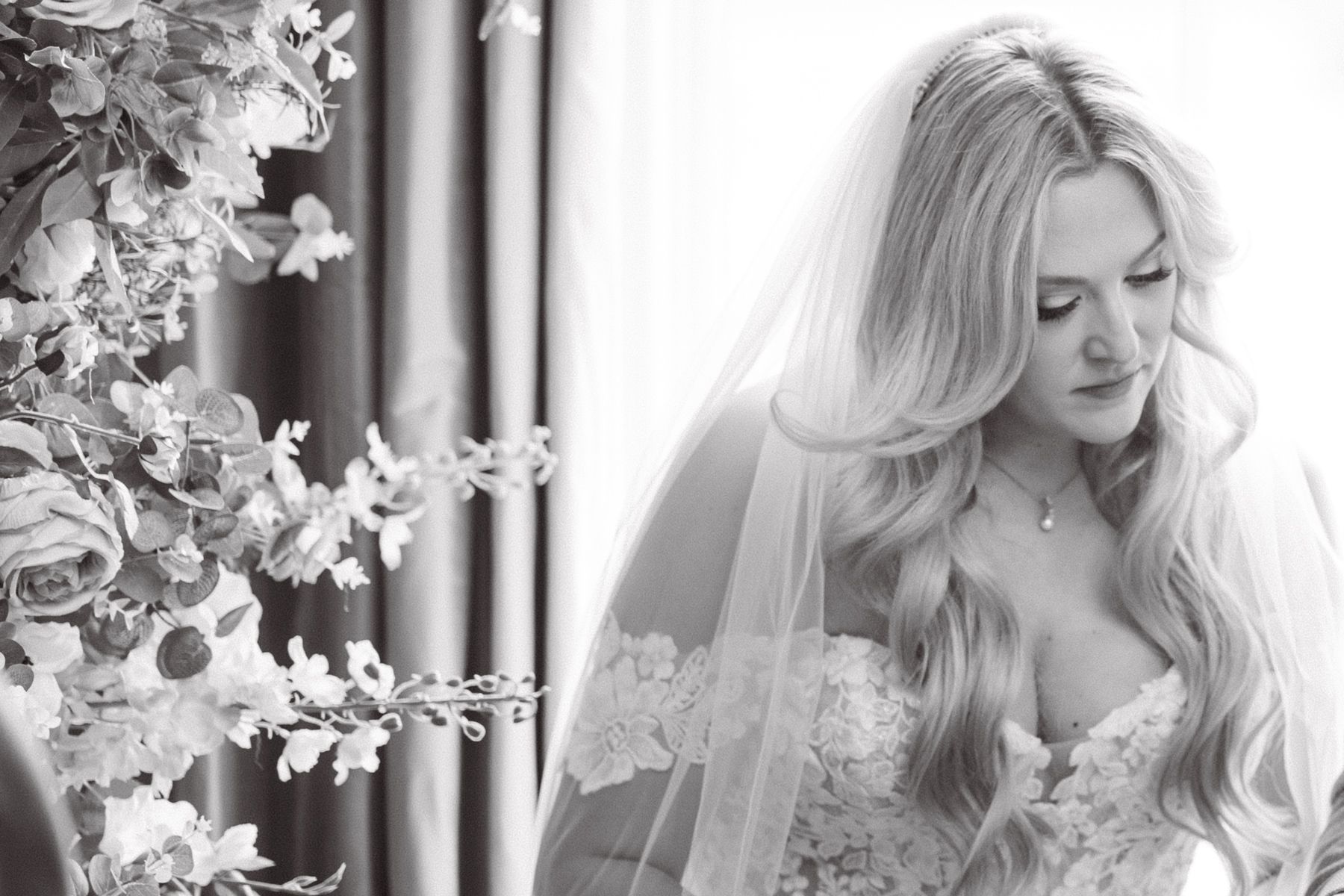 The bride signs the register.
