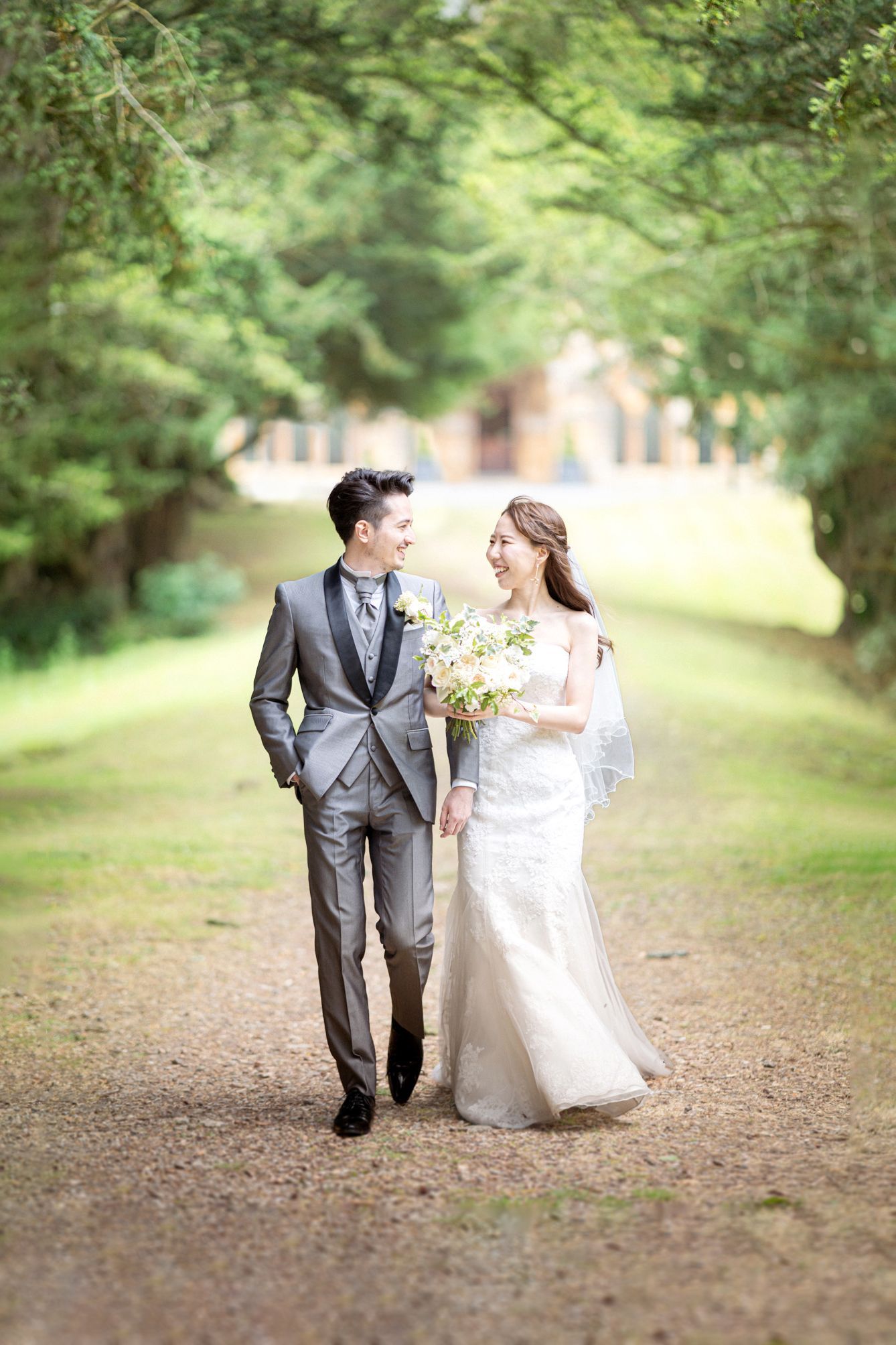 Candid portrait of a bride and groom at a luxury wedding chateau venue.