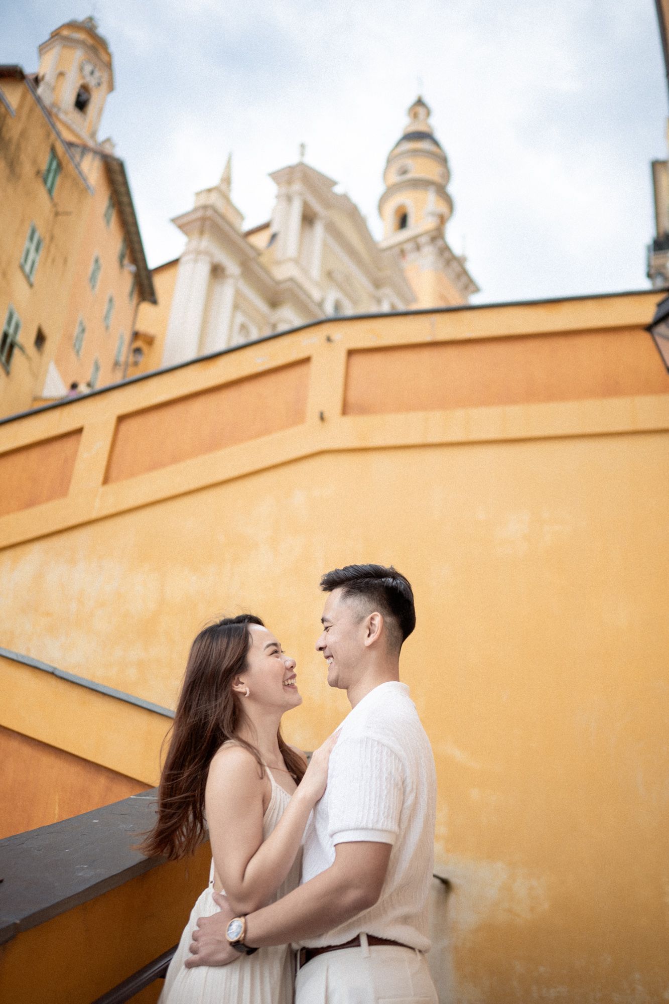 Menton's iconic yellow staircase as the backdrop for a romantic couple photoshoot.
