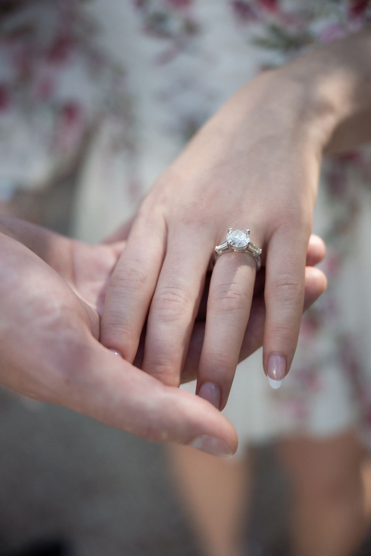 A close up of an engagement ring.