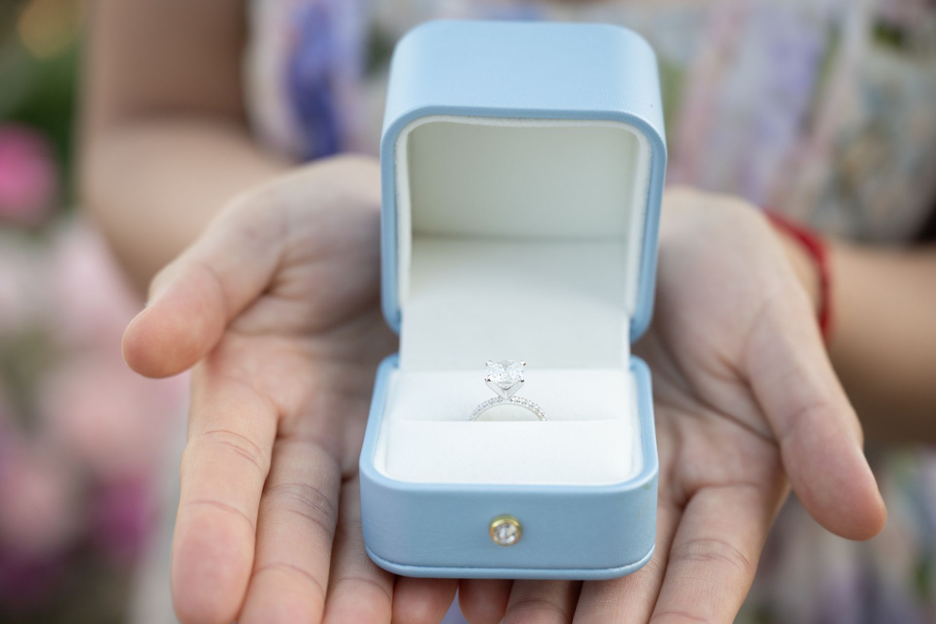 A diamond engagement ring in a box.