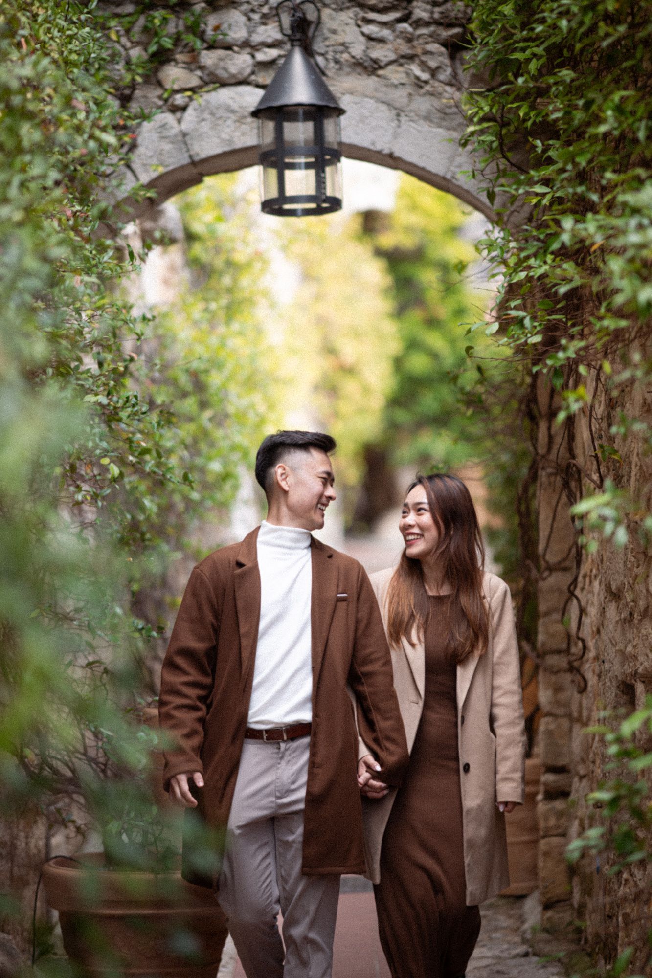 A couple laugh during a romantic couple shoot in Eze.