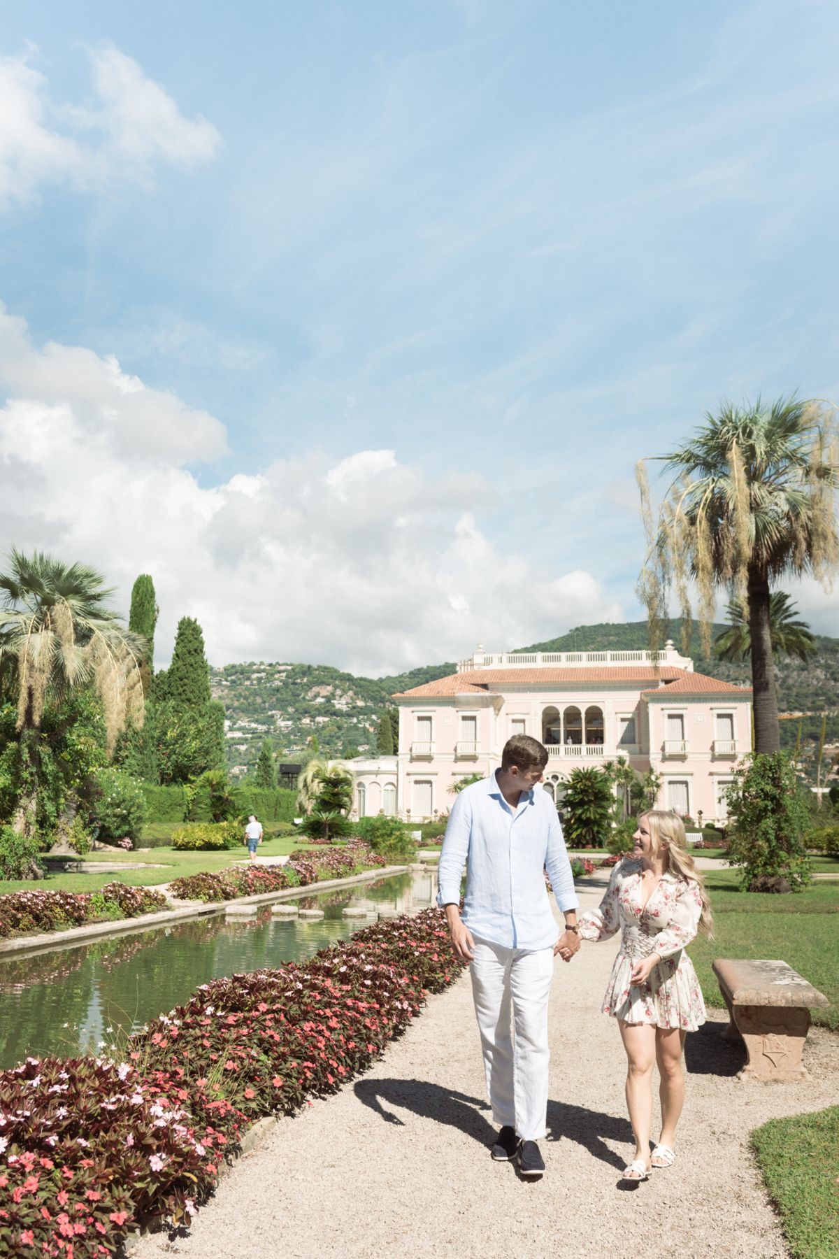 A couple walk down the garden at Villa Ephrussi during a couple photoshoot.