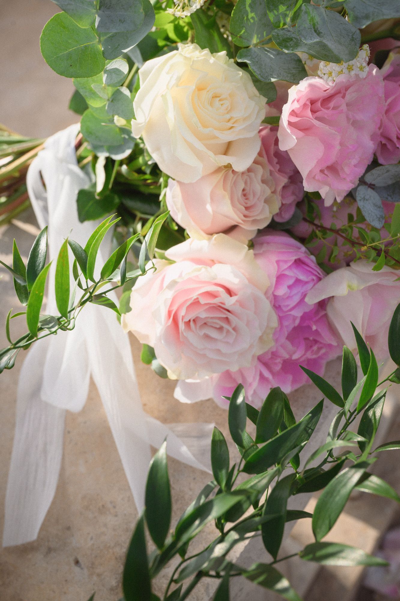 A bouquet of pink and white flowers before a proposal in Eze village.