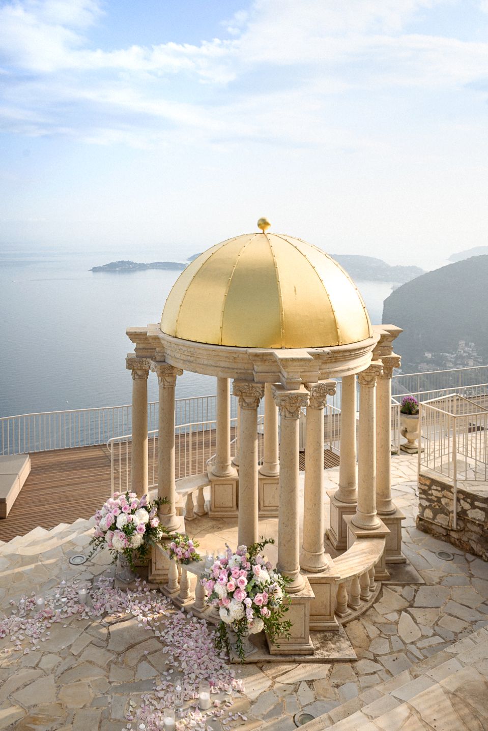 The Temple of Love in Eze village Chevre d'Or Hotel at sunset before a proposal with a flower display.