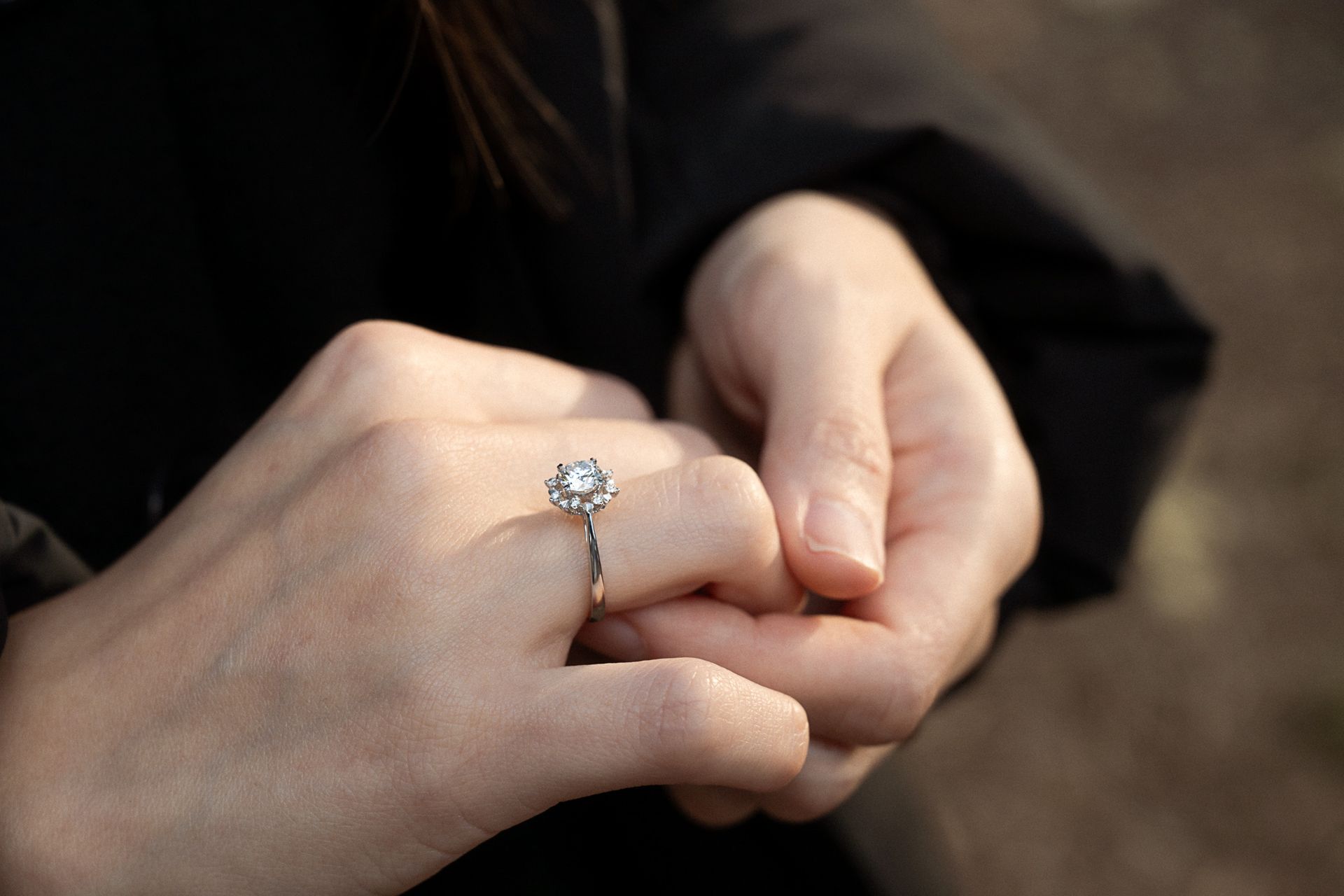 close up of a diamond engagement ring during a durprise proposal