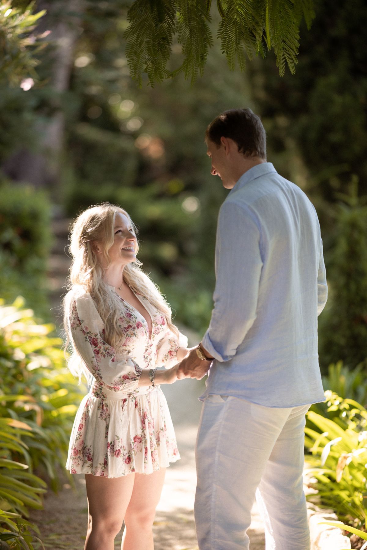 A couple under beautiful dappled light during a romantic photoshoot at Villa Ephrussi.
