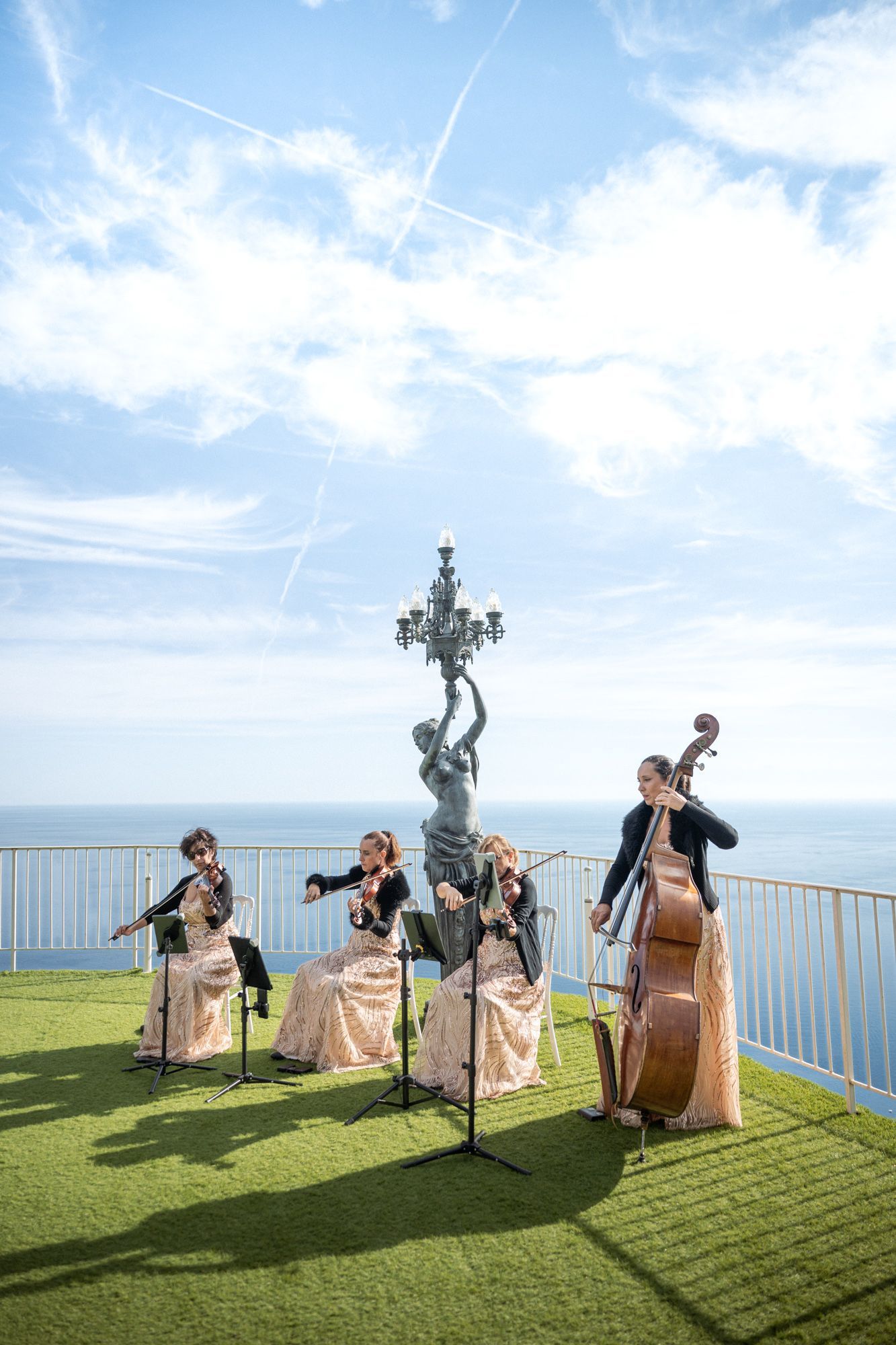 A string quartet at the Chevre d'Or Hotel during a wedding ceremony on the Rose Terrace 