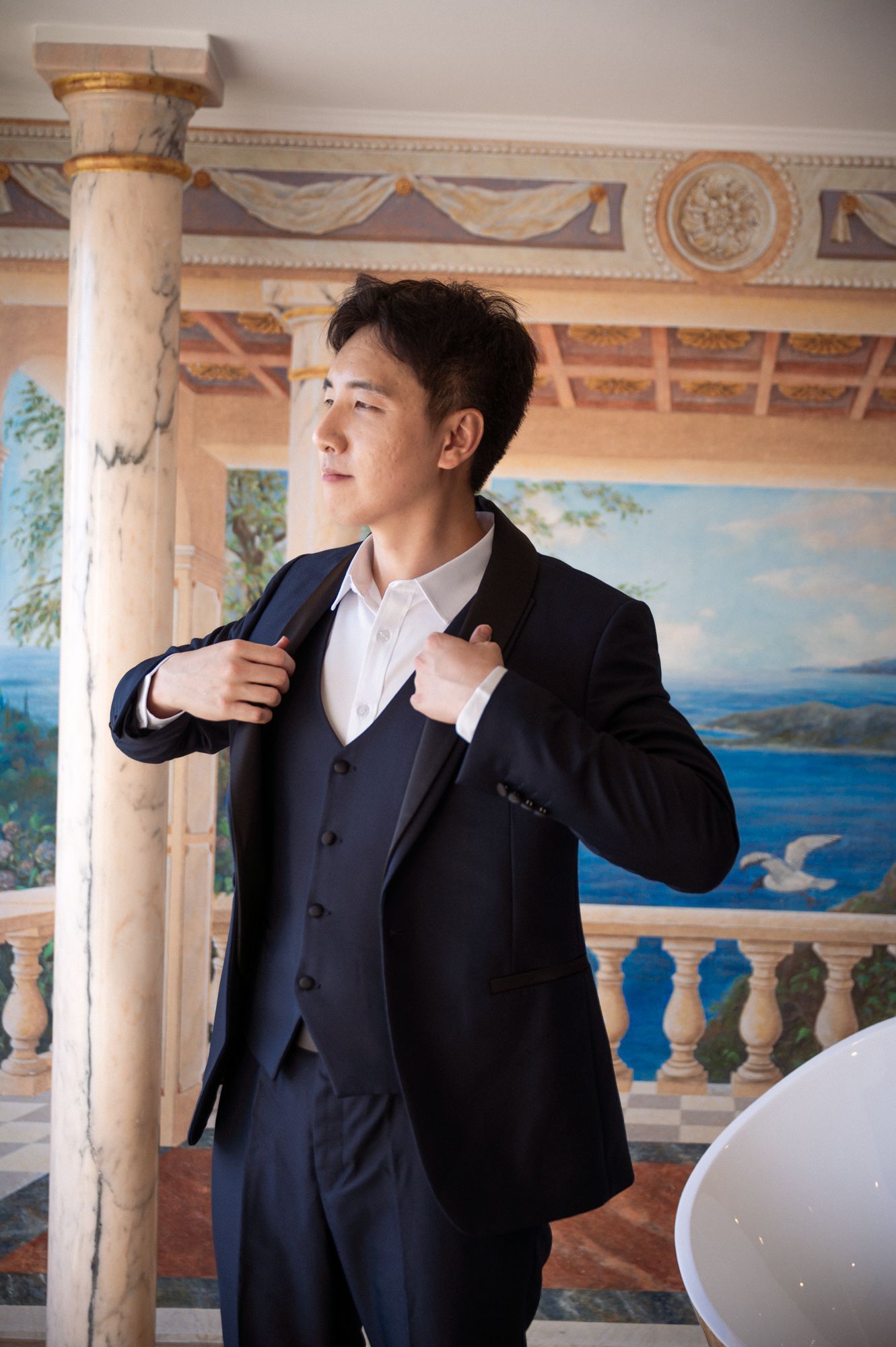 A portrait of the groom in the Panoramic Suite of the Chevre d'Or Hotel on the French Riviera