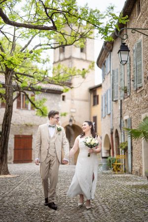 Natural, relaxed wedding photography of a bride and groom walking through a Provincial village in the south of France.