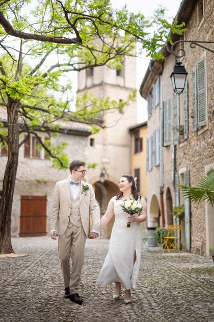 Natural, relaxed wedding photography of a bride and groom walking through a Provincial village in the south of France.