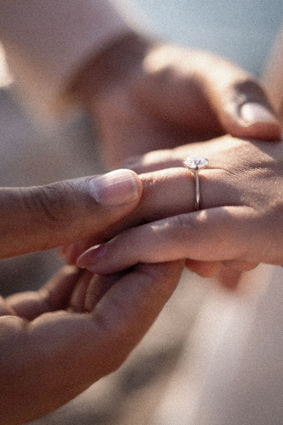 A detail shot of an engagement ring after a surprise proposal.
