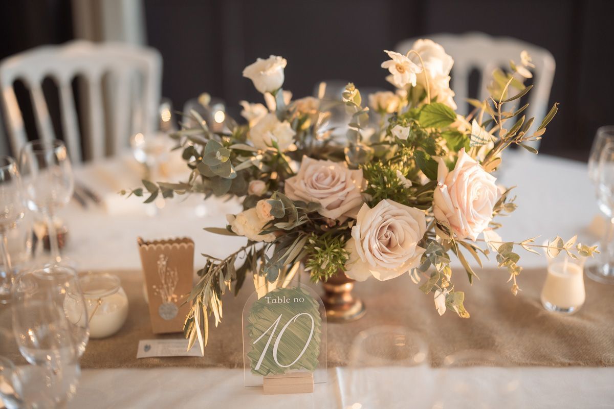 table display flowers on a wedding day at Chateau Crémat