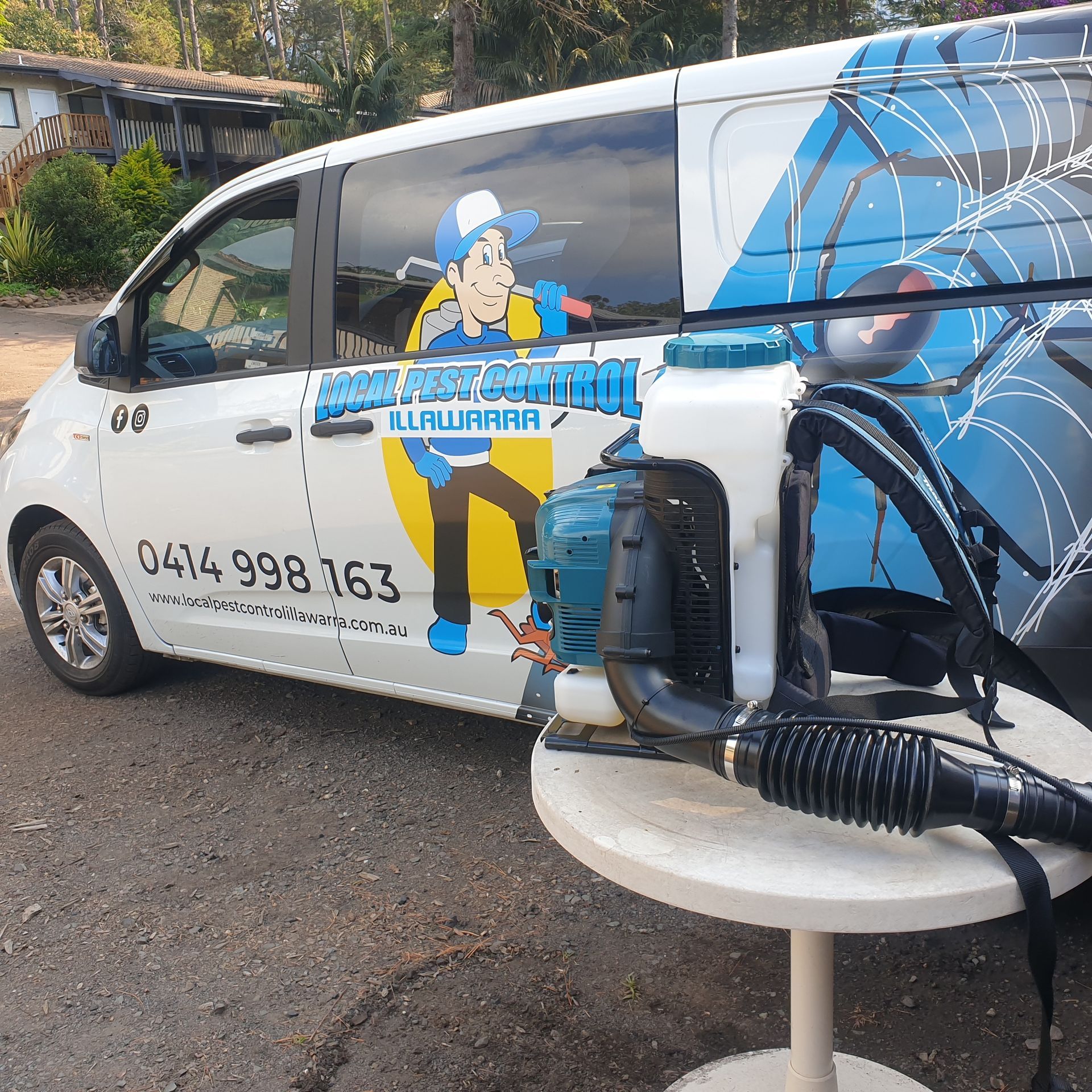 A Cricket Bat Is Sitting On A Cooler Next To A Truck — Local Pest Control Illawarra in Shellharbour, NSW