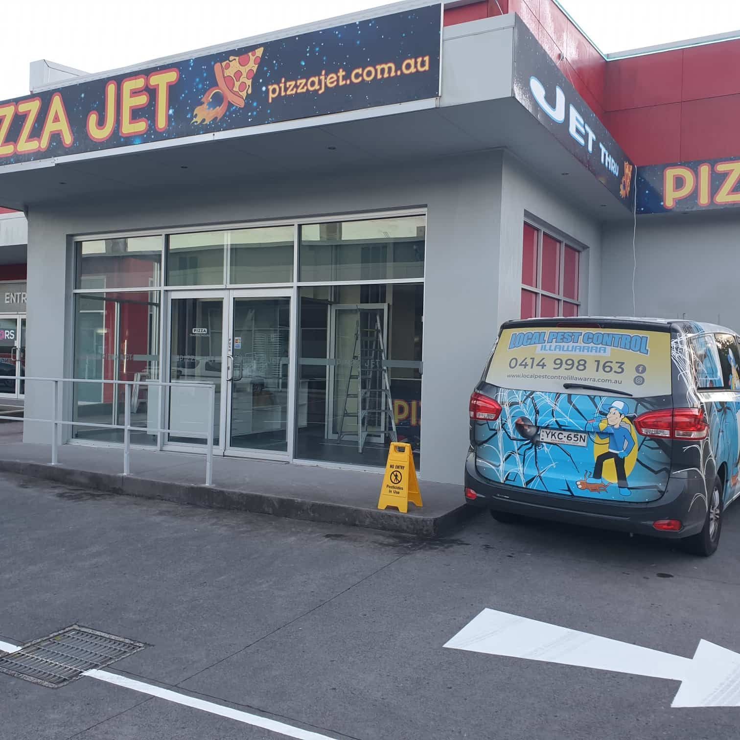 A Pest Control Van Outside Of A Pizza Store — Local Pest Control Illawarra in Horsley, NSW