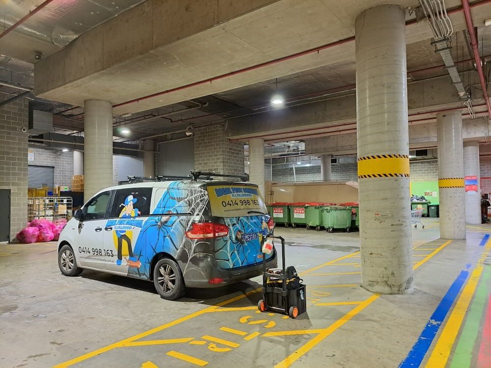 A Blue And White Van Is Parked In A Parking Lot — Local Pest Control Illawarra in Shellharbour, NSW
