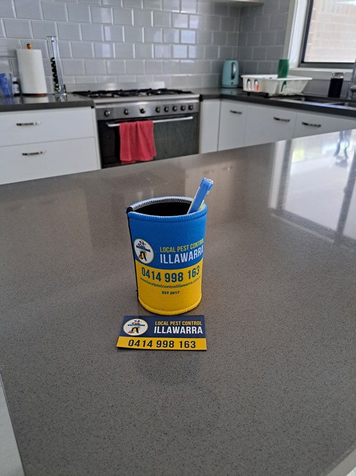 A Blue And Yellow Bucket With A Toothbrush — Local Pest Control Illawarra in Shellharbour, NSW