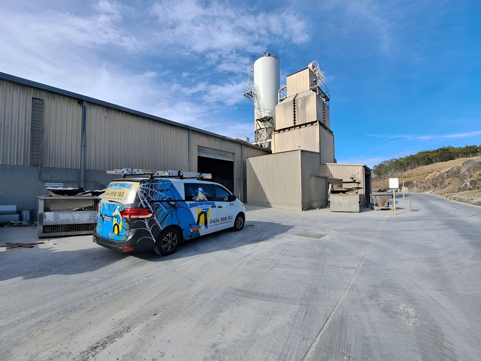 A Pest Control Van Outside Of Large Warehouse — Local Pest Control Illawarra in Horsley, NSW