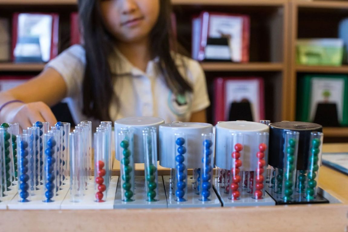 Montessori children working with montessori materials