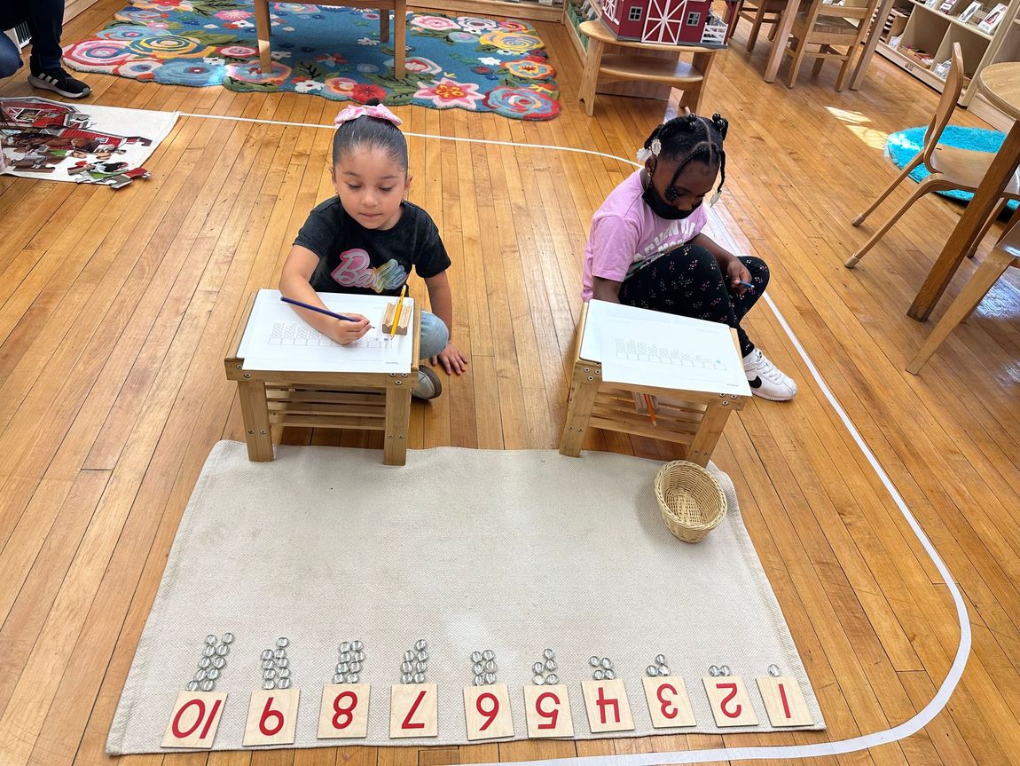 Montessori children working with montessori materials