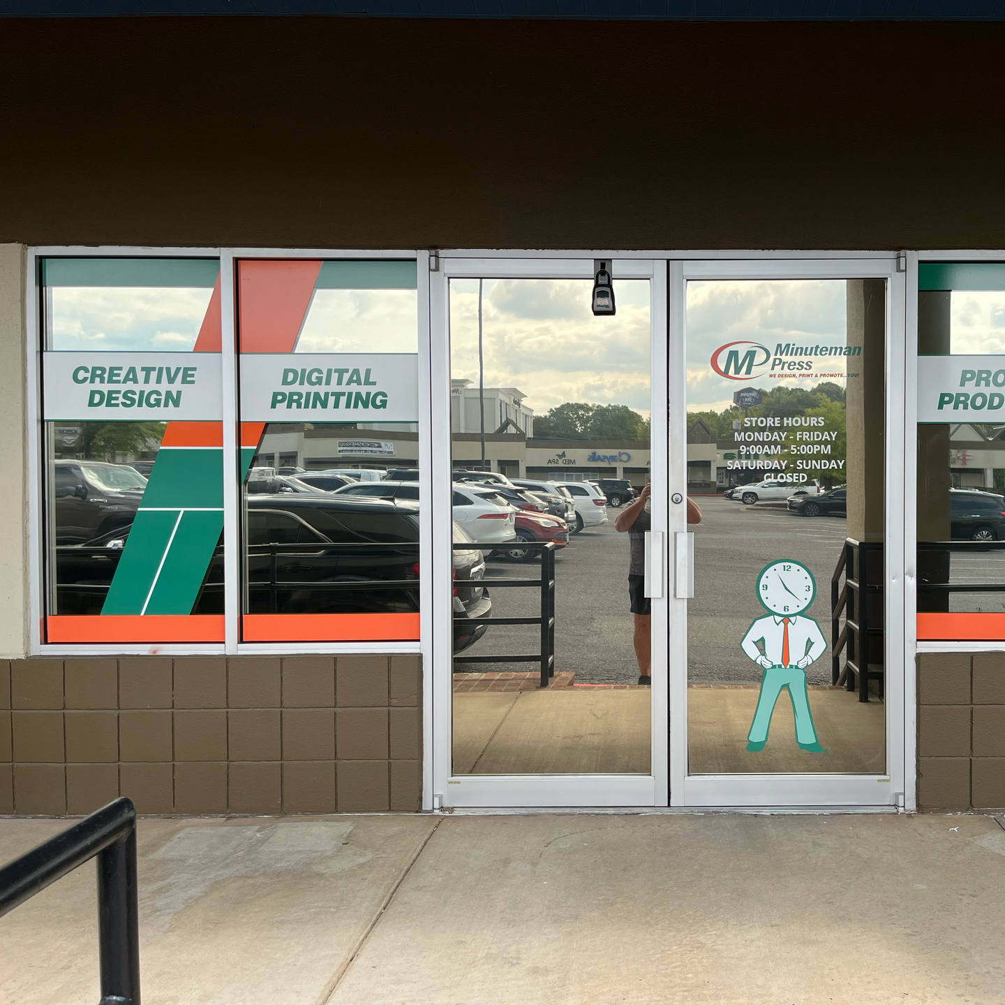 Exterior of a print shop with glass doors, featuring  signage | sign printer near me 