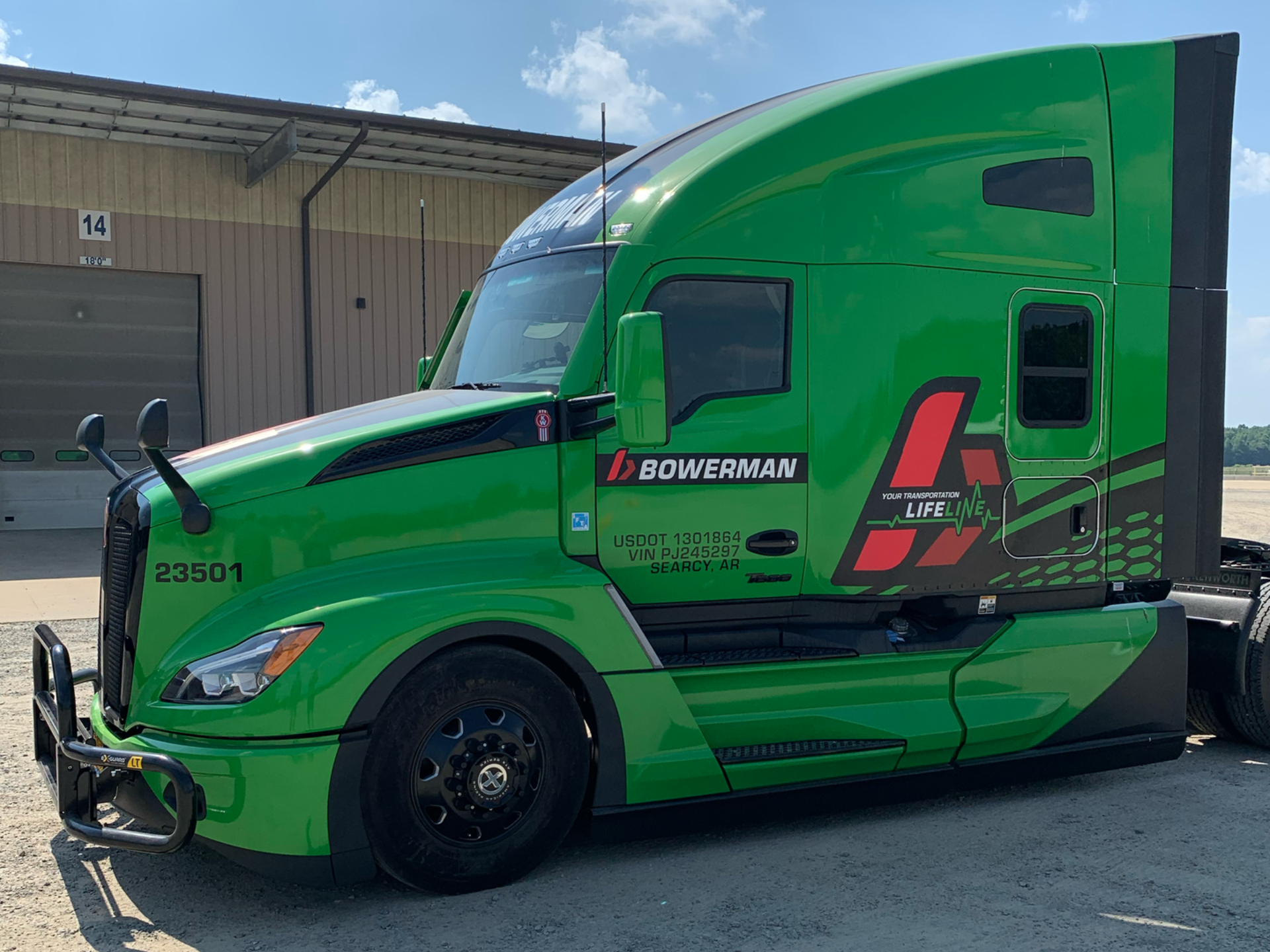 Green semi-truck with black accents | custom vehicle graphics near me
