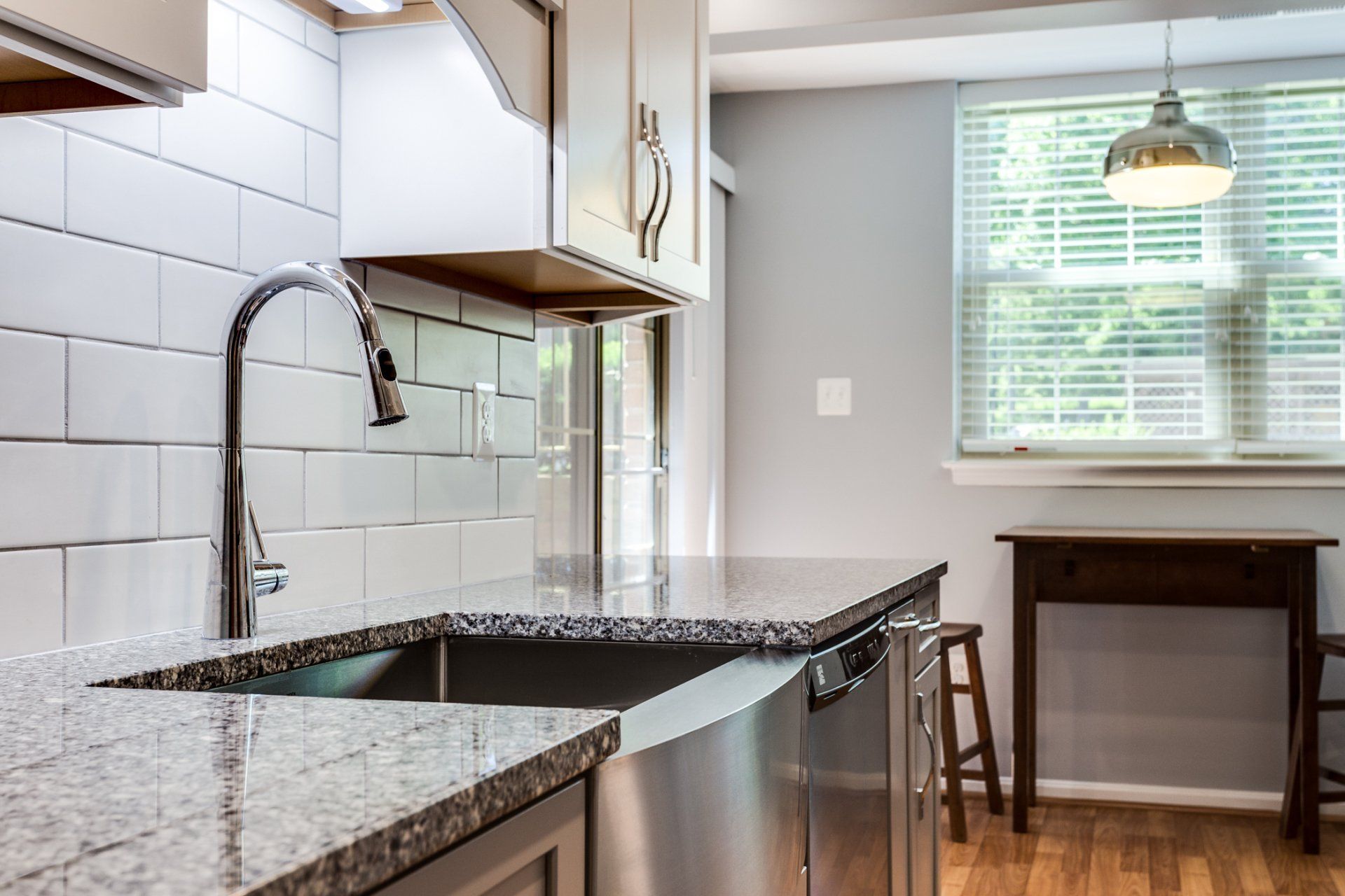 A kitchen with stainless steel appliances and granite counter tops