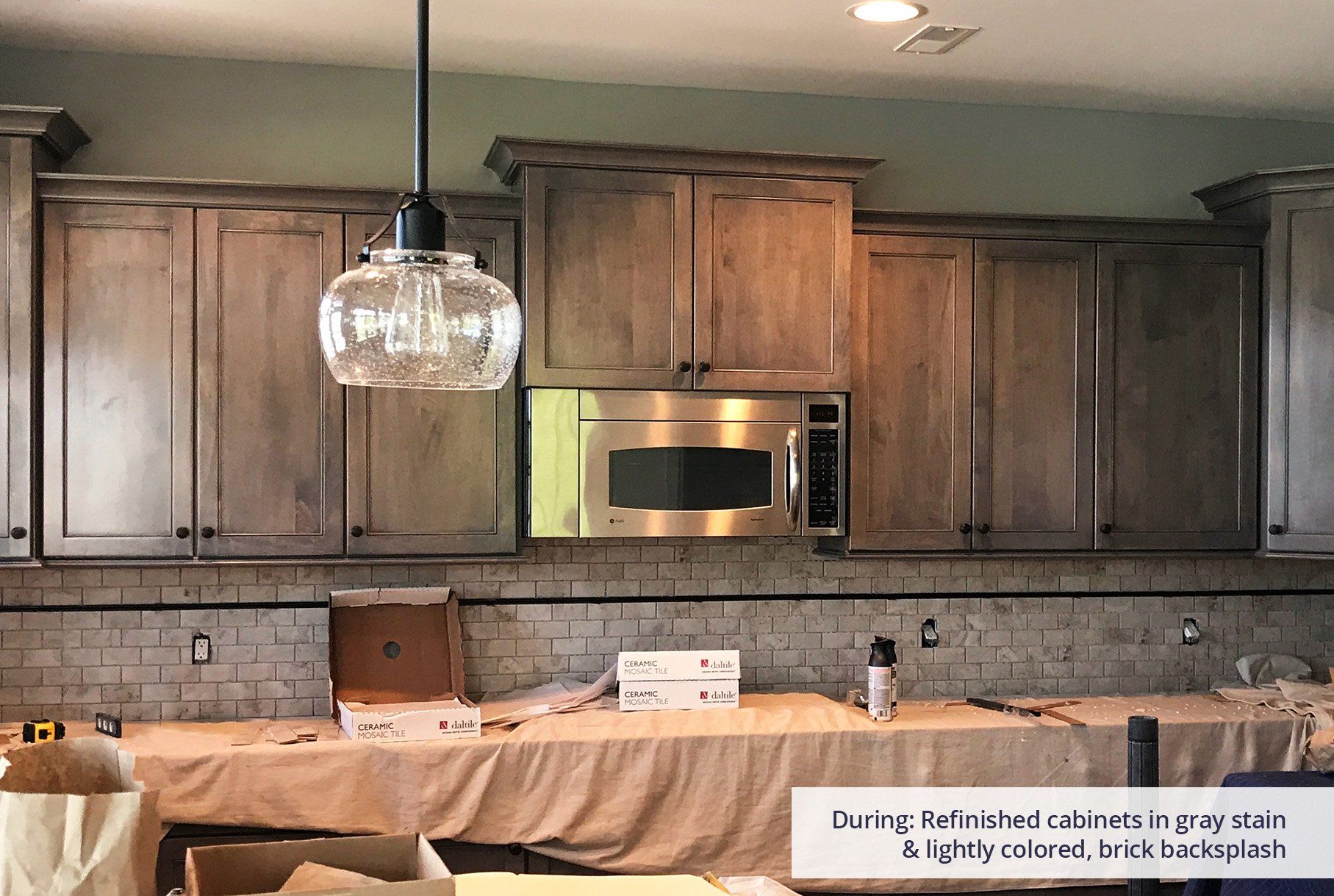 A kitchen with stainless steel appliances and wooden cabinets