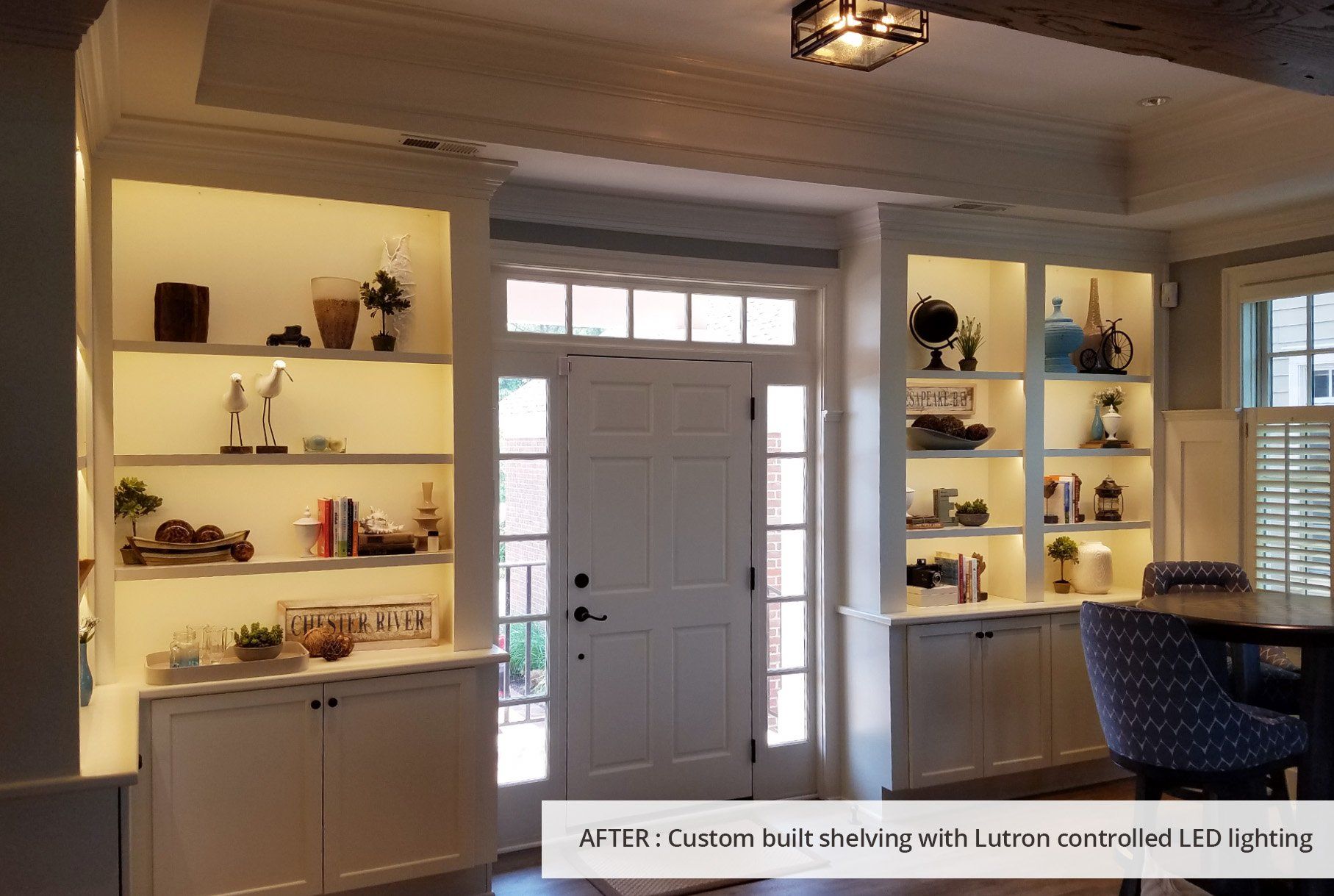 A living room with lots of shelves and a table