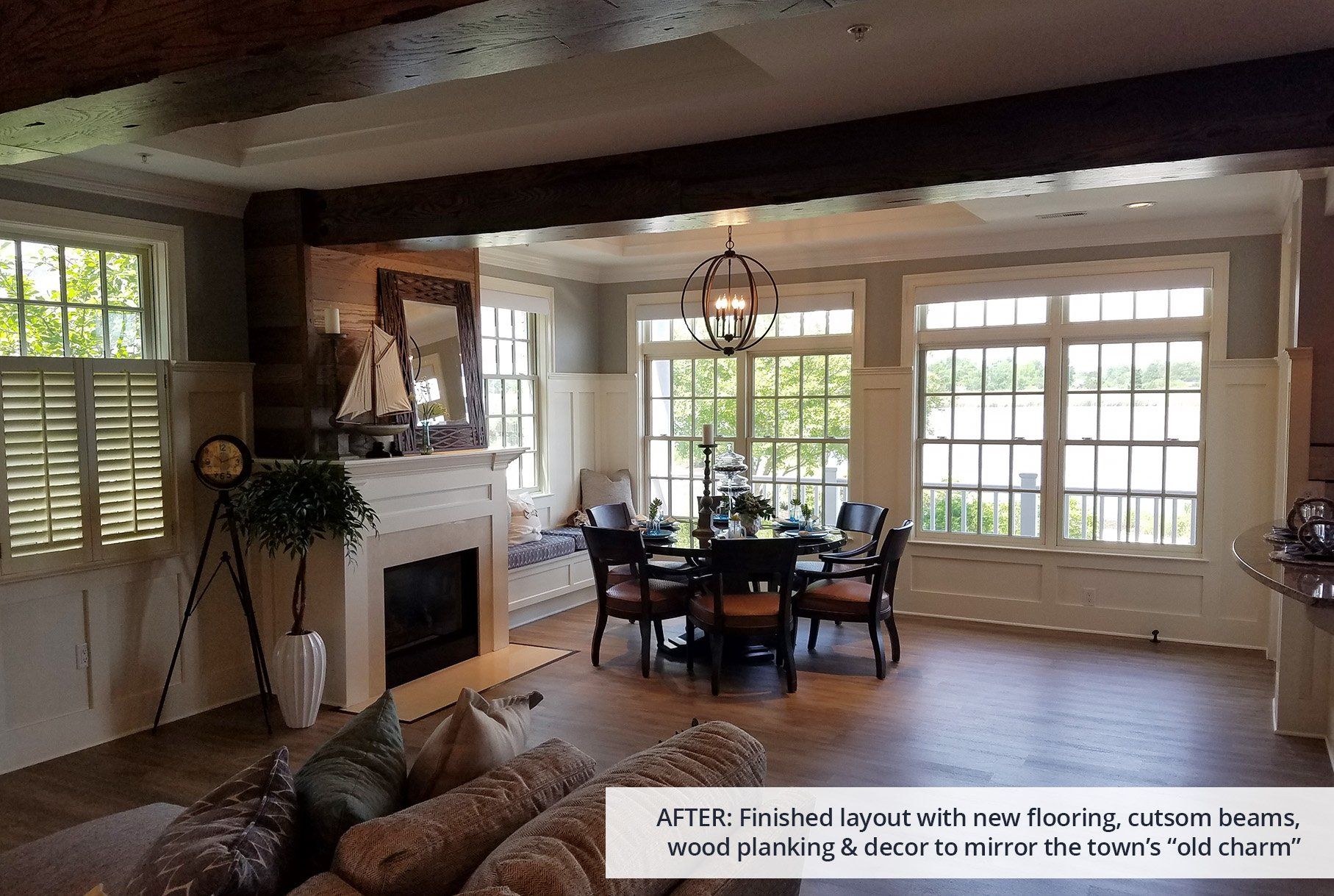 A living room with a fireplace and a dining room table