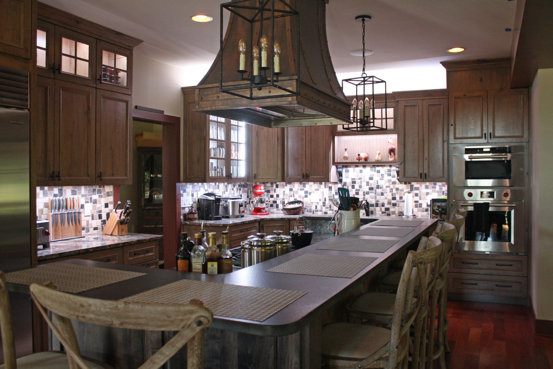 A kitchen with wooden cabinets and stainless steel appliances