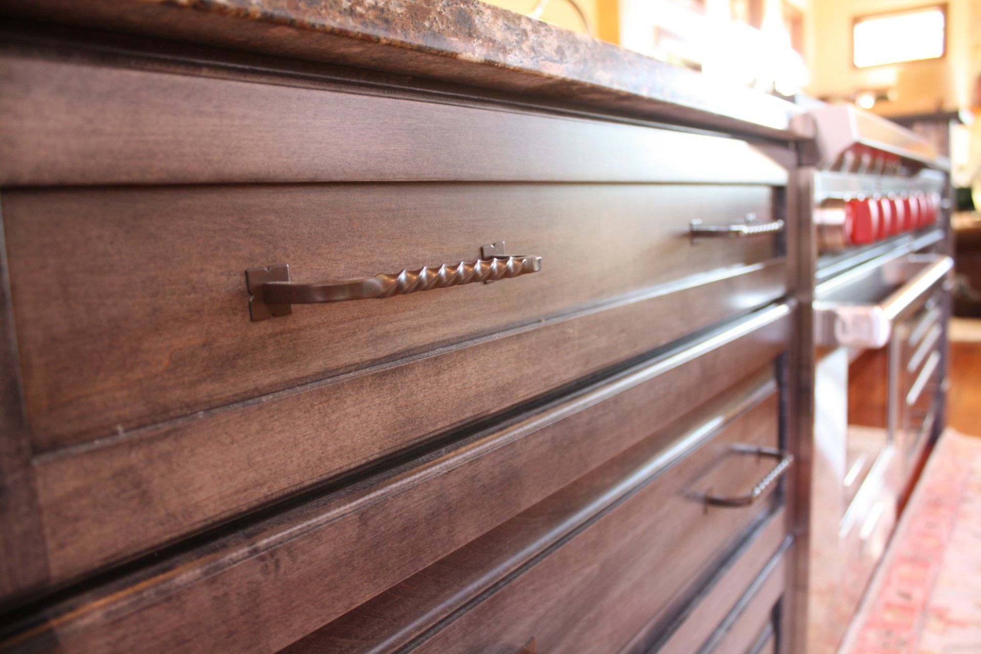 A kitchen with stainless steel appliances and wooden cabinets