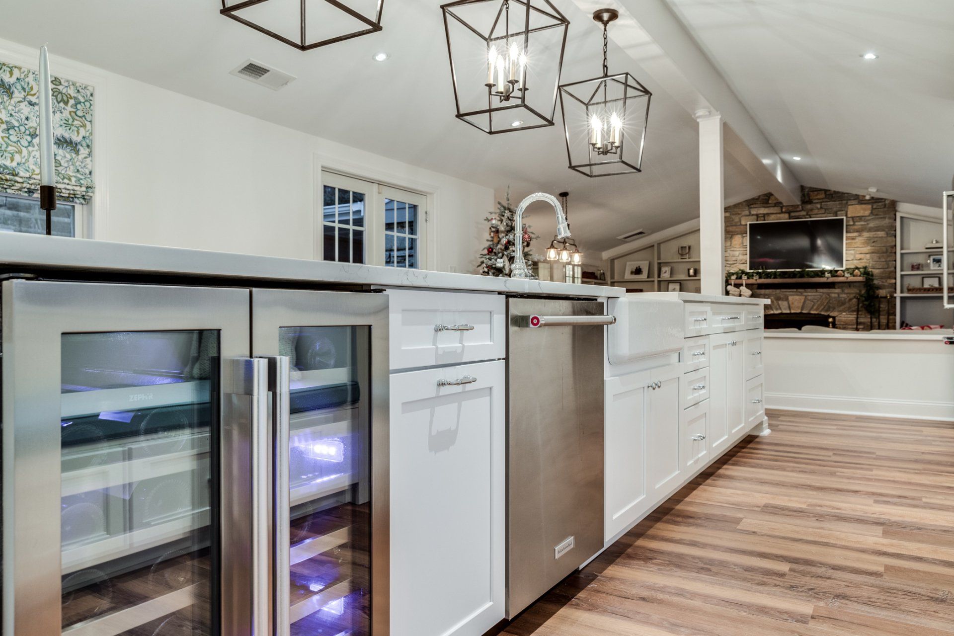 A kitchen with stainless steel appliances and a wine cooler