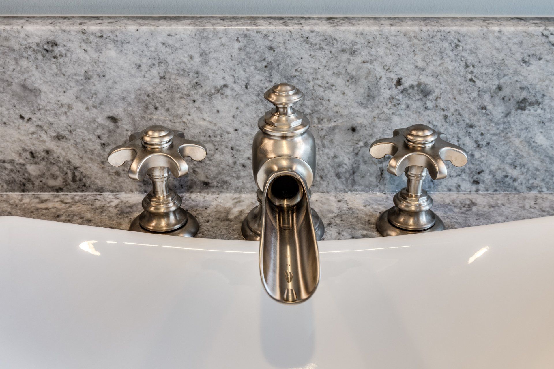 A close up of a faucet on a bathroom sink.
