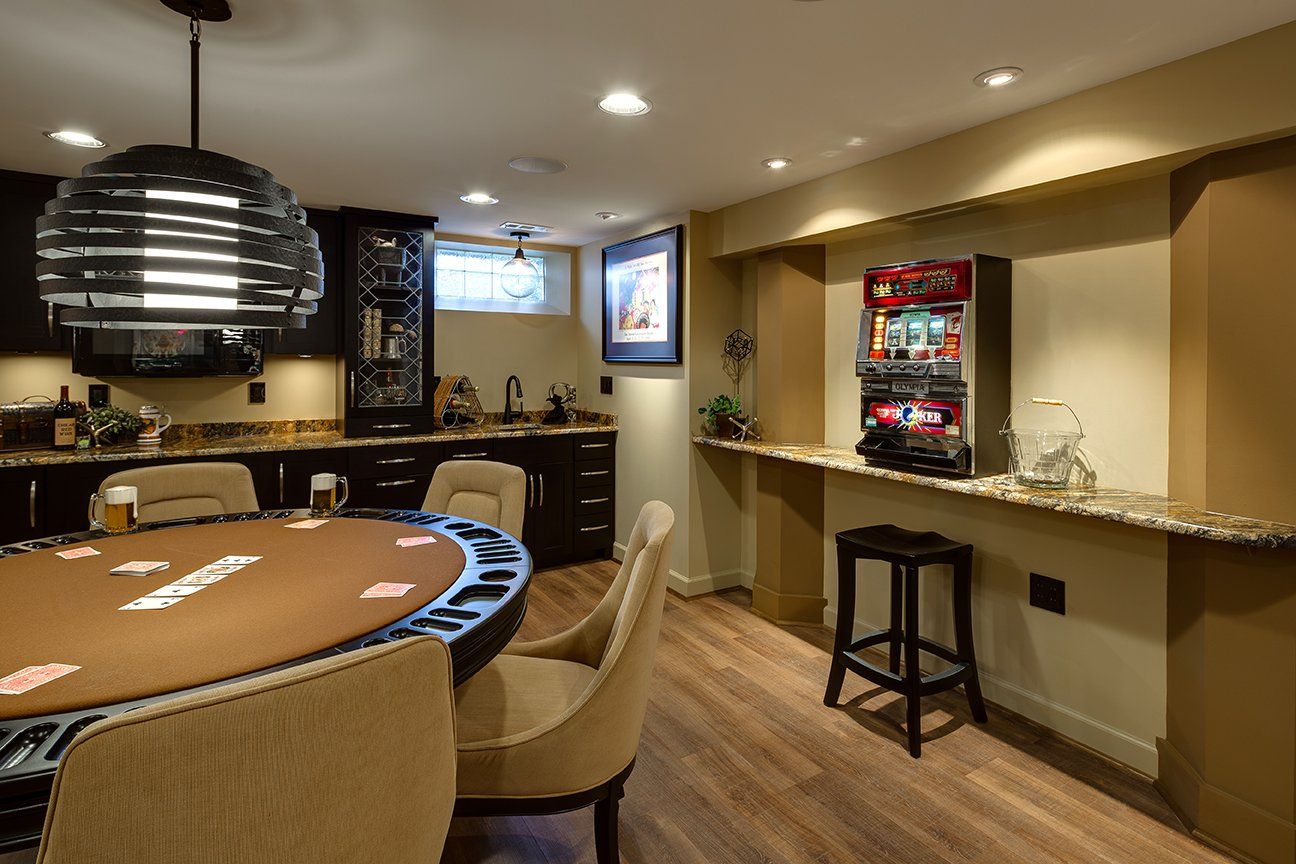 There is a poker table in the middle of the room.