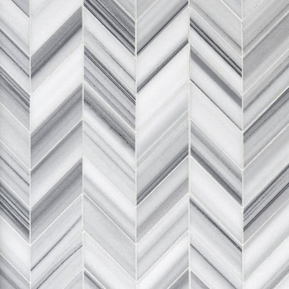 A close up of a marble tile with a chevron pattern.