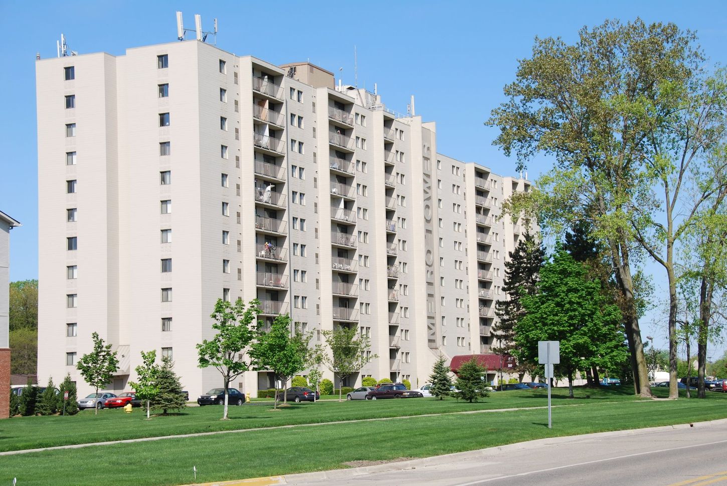 A tall building with a lot of windows and balconies