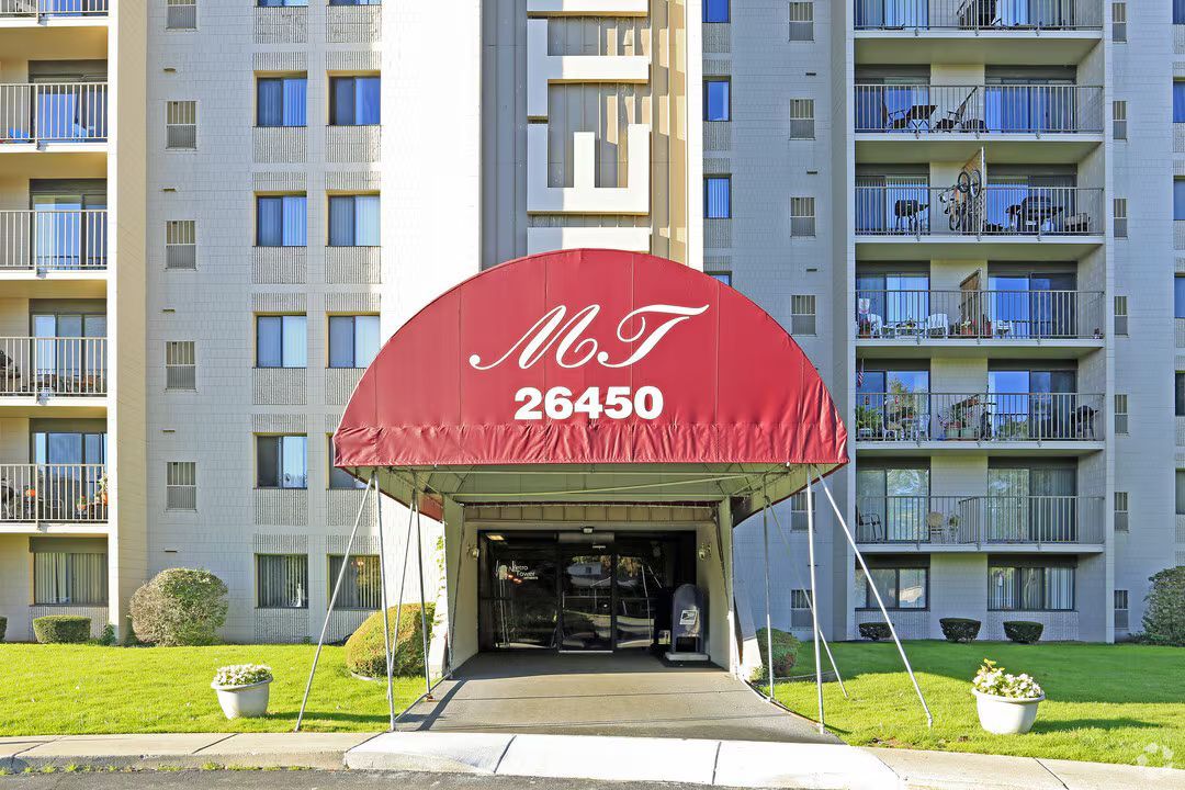 A building with a red awning that says mt 26450