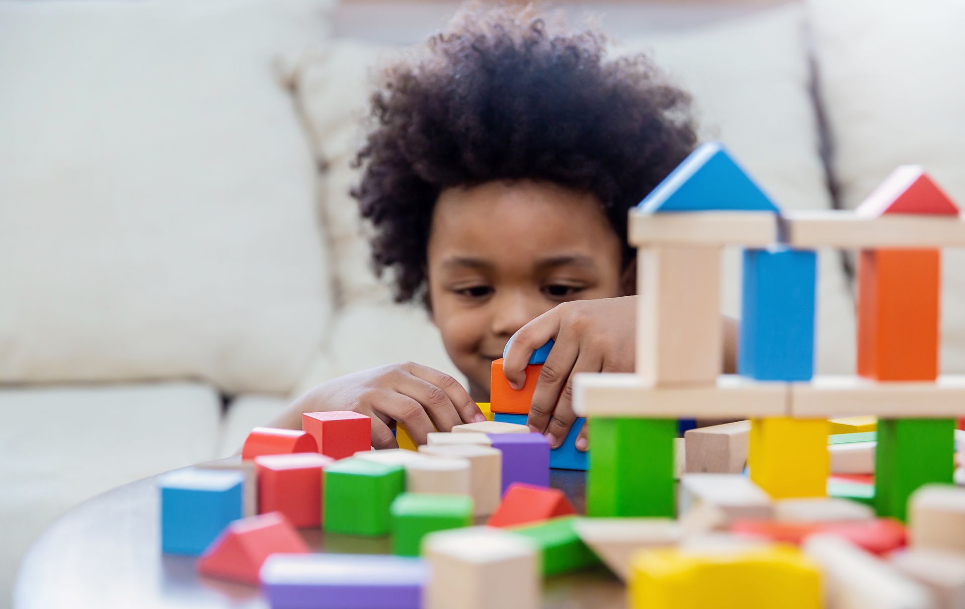 Child playing with blocks on table