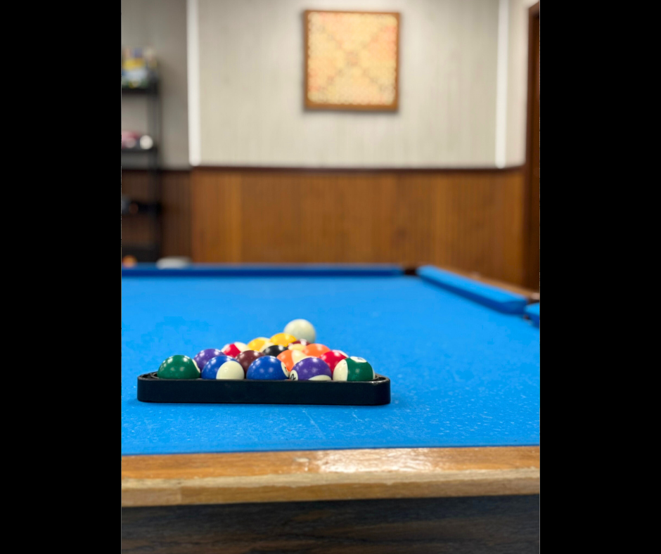 Pool balls on a pool table.