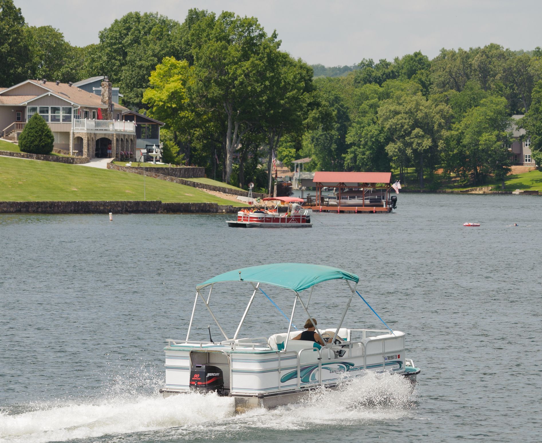 A group of people in rafts are floating down a river.