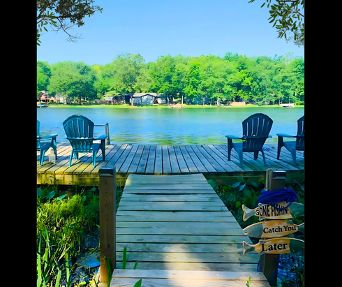 Dock with chairs facing lake