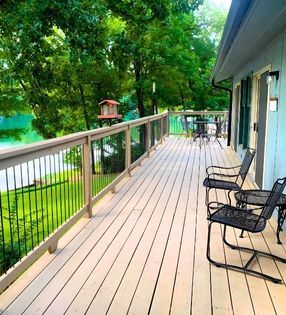 Dock with chairs facing lake
